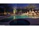 Inviting pool and spa area with desert landscaping at 41711 N Maidstone Ct, Anthem, AZ 85086