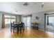 Dining area with a table and chairs, hardwood floors, and a view to the backyard at 46166 W Sheridan Rd, Maricopa, AZ 85139