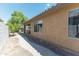 Home exterior with covered patio and walkway at 46166 W Sheridan Rd, Maricopa, AZ 85139