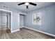 Bedroom with gray walls, wood-look floors, and a window with a view at 4626 S 8Th St, Phoenix, AZ 85040