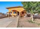 Yellow house with arched entryway, steps, and a tree in front at 4626 S 8Th St, Phoenix, AZ 85040