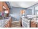 Kitchen with wood cabinets, tile countertops, and a gas range at 4626 S 8Th St, Phoenix, AZ 85040