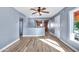 Living room with light gray walls, wood-look floors, and a view into the kitchen at 4626 S 8Th St, Phoenix, AZ 85040