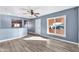 Living room with gray walls, wood-look floors, and a view of the kitchen at 4626 S 8Th St, Phoenix, AZ 85040