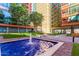 Modern building courtyard with fountain and artificial turf at 4808 N 24Th St # 605, Phoenix, AZ 85016