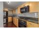 Modern kitchen with granite countertops and stainless steel appliances at 4808 N 24Th St # 605, Phoenix, AZ 85016