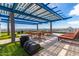 Rooftop deck with dining area, lounge chairs, and city views at 4808 N 24Th St # 605, Phoenix, AZ 85016