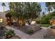 Landscaped backyard with stone pathway and fire pit at 4836 E Moonlight Way, Paradise Valley, AZ 85253