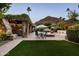 Landscaped backyard oasis with pool and pergola at 4836 E Moonlight Way, Paradise Valley, AZ 85253