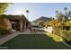 Landscaped backyard with pool, patio, and mountain views at 4836 E Moonlight Way, Paradise Valley, AZ 85253