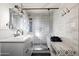 Spa-like bathroom with patterned tile and a built-in bench at 4836 E Moonlight Way, Paradise Valley, AZ 85253