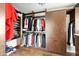 Large walk-in closet with ample shelving and hanging space at 4836 E Moonlight Way, Paradise Valley, AZ 85253