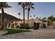 Evening view of home showcasing landscaping and gated entry at 4836 E Moonlight Way, Paradise Valley, AZ 85253