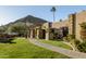 Landscaped front yard with walkway leading to home entrance at 4836 E Moonlight Way, Paradise Valley, AZ 85253