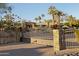 Ornate iron gate entrance to a beautiful property at 4836 E Moonlight Way, Paradise Valley, AZ 85253