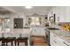 Modern kitchen with granite counters, white cabinets, and stainless steel appliances at 4836 E Moonlight Way, Paradise Valley, AZ 85253