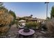 Landscaped backyard with fire pit and seating area at 4836 E Moonlight Way, Paradise Valley, AZ 85253