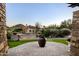 Stone patio with fire feature and mountain views at 4836 E Moonlight Way, Paradise Valley, AZ 85253