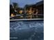 Relaxing pool and spa at night with elegant landscaping and lighting at 4836 E Moonlight Way, Paradise Valley, AZ 85253