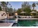 Spacious pool and spa with fountain and lounge chairs at 4836 E Moonlight Way, Paradise Valley, AZ 85253