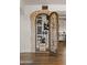 Custom wine cellar with wrought iron door and ample storage at 4836 E Moonlight Way, Paradise Valley, AZ 85253