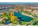 Aerial view of a community park with pond, playground, and walking paths at 5015 S Quantum Way, Mesa, AZ 85212