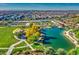 Aerial view of a community park with pond, playground, and walking paths at 5015 S Quantum Way, Mesa, AZ 85212