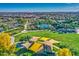 Aerial view of community amenities including a pool, playground, and expansive green spaces at 5015 S Quantum Way, Mesa, AZ 85212