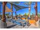 Outdoor kitchen and dining area with shade sails at 5015 S Quantum Way, Mesa, AZ 85212