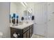 Double vanity bathroom with dark brown cabinets at 5015 S Quantum Way, Mesa, AZ 85212