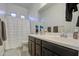 Bathroom boasts double sinks and shower/tub combo at 5015 S Quantum Way, Mesa, AZ 85212