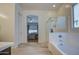 Bathroom with tub, shower, and view into bedroom at 5015 S Quantum Way, Mesa, AZ 85212