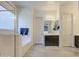 Modern bathroom with double sinks and soaking tub at 5015 S Quantum Way, Mesa, AZ 85212