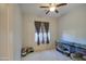 Bright bedroom with neutral decor and ceiling fan at 5015 S Quantum Way, Mesa, AZ 85212