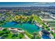 Scenic community lake with walking paths and lush landscaping at 5015 S Quantum Way, Mesa, AZ 85212