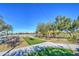 Relaxing community lawn with tables and string lights at 5015 S Quantum Way, Mesa, AZ 85212