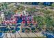 Aerial view of a community outdoor cafe with red umbrellas and tables at 5015 S Quantum Way, Mesa, AZ 85212