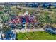 Aerial view of a community outdoor cafe with red umbrellas and tables at 5015 S Quantum Way, Mesa, AZ 85212