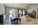 Bright dining room with sliding glass doors leading to the backyard at 5015 S Quantum Way, Mesa, AZ 85212