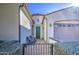 Front entry with green door and wrought iron gate at 5015 S Quantum Way, Mesa, AZ 85212