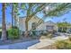 Single story home with neutral exterior, two-car garage, and landscaped front yard at 5015 S Quantum Way, Mesa, AZ 85212