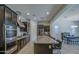 Modern kitchen featuring dark cabinetry and a large island at 5015 S Quantum Way, Mesa, AZ 85212