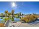 Relaxing lakeside bench with scenic pond view at 5015 S Quantum Way, Mesa, AZ 85212