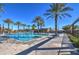 Resort-style pool with palm trees and lounge chairs at 5015 S Quantum Way, Mesa, AZ 85212