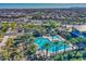 Resort-style pool with lounge chairs and palm trees in a community setting at 5015 S Quantum Way, Mesa, AZ 85212