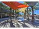 Relaxing water feature with shade structures and palm trees at 5015 S Quantum Way, Mesa, AZ 85212