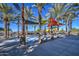 Refreshing water feature with shade structures and palm trees at 5015 S Quantum Way, Mesa, AZ 85212