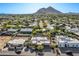 Aerial view of house and surrounding neighborhood, mountains in background at 5028 N Scottsdale Rd, Paradise Valley, AZ 85253