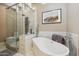 Luxurious bathroom with a soaking tub and large walk-in shower at 5028 N Scottsdale Rd, Paradise Valley, AZ 85253