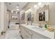 Elegant bathroom with double vanity, soaking tub, and marble floors at 5028 N Scottsdale Rd, Paradise Valley, AZ 85253